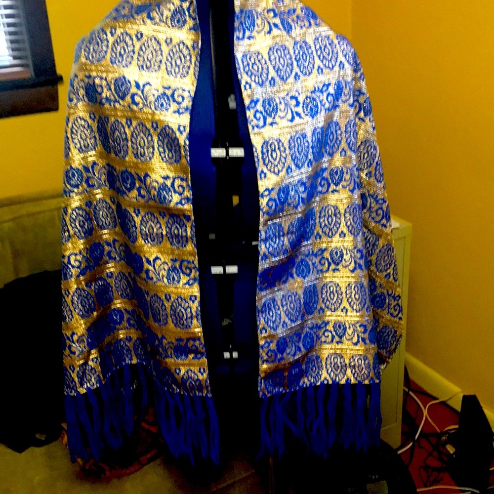 Shawl blue and gold. Polyester. 20 wide x 62 long. Fringe 6 inches yarn.